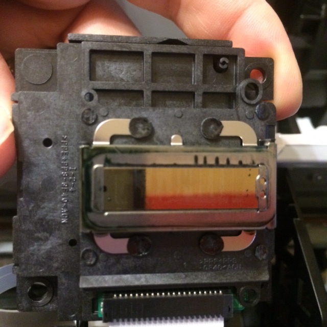 Inspect the printhead for scratches, ink globs, or other debris